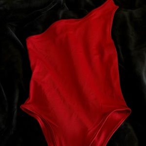 Red one shoulder body suit